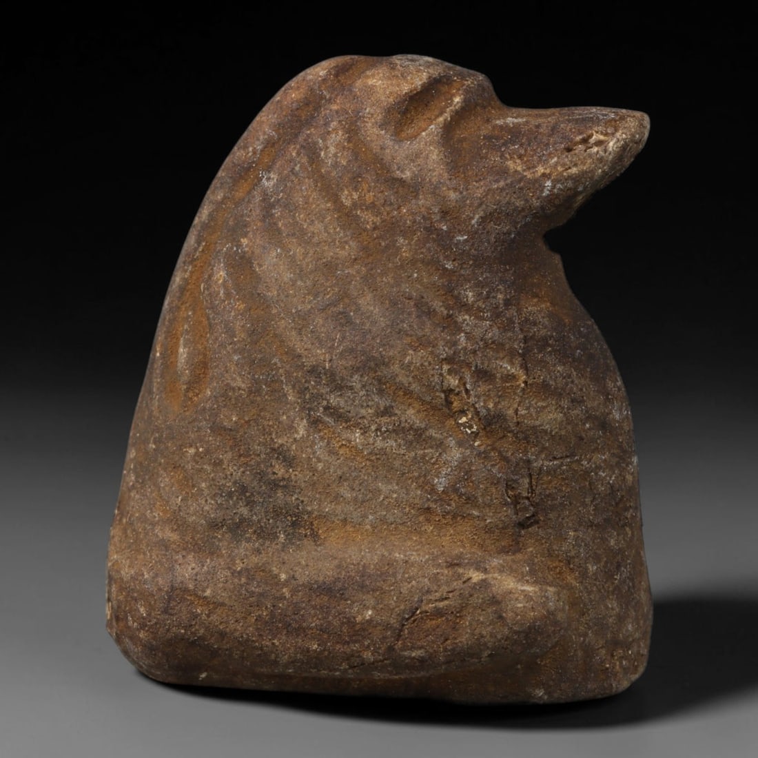 Ancient Medieval Near Eastern Tribal Hand Carved Stone Effigy Amulet, 43AC: Medium antique portable sacred effigy hand hewn from natural sedimentary stone, originating from Medieval Near Eastern tribal craft and spiritual traditions. Solid stone effigies were staple devotiona