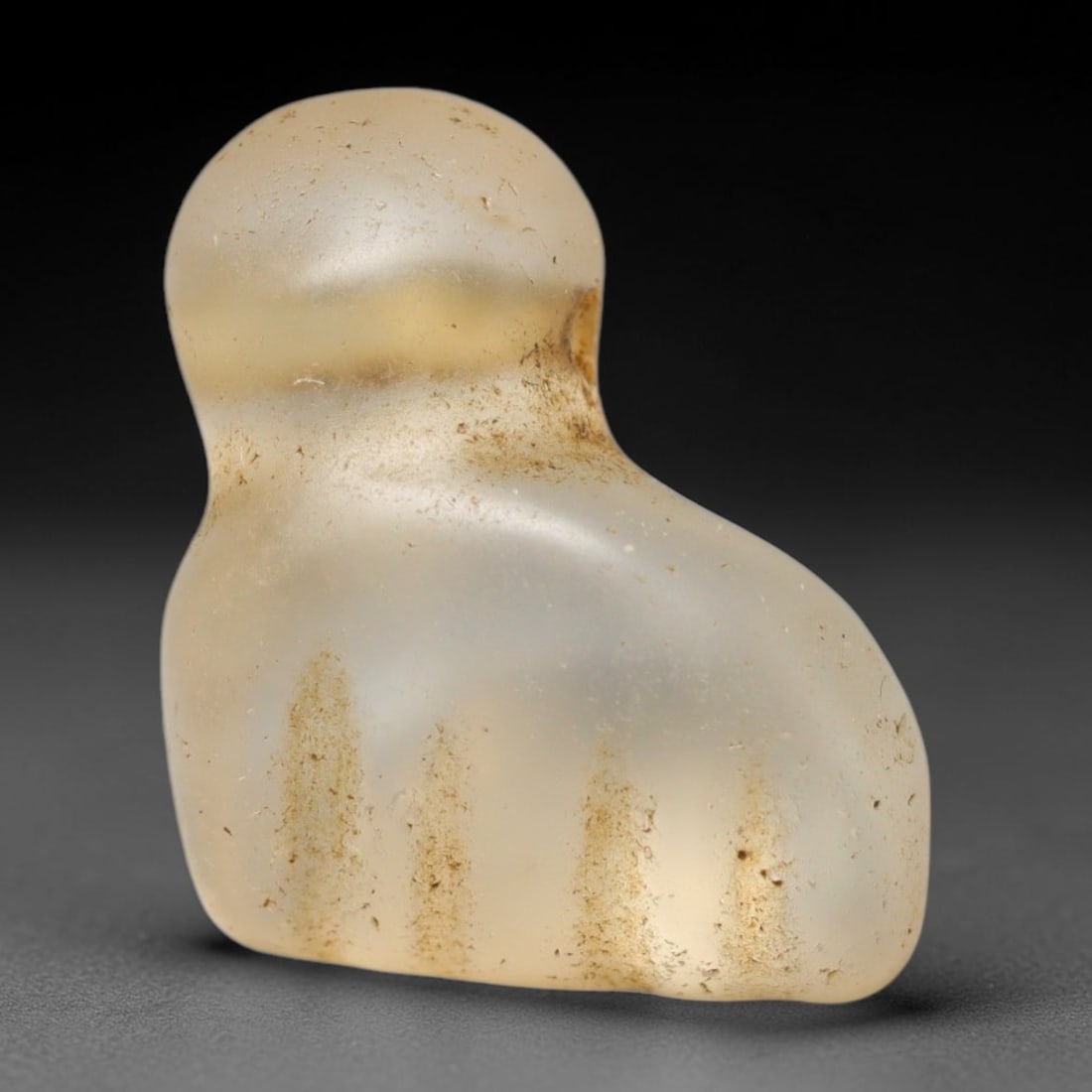 Ancient Medieval Coptic Christian Egyptian Culture Rock Crystal Fist Amulet (300-1000 CE), 79FY: This antique rock crystal amulet originates from Coptic Christian Egyptian Culture, where translucent hardstone talismans were widely fashioned for personal devotion and burial customs throughout late