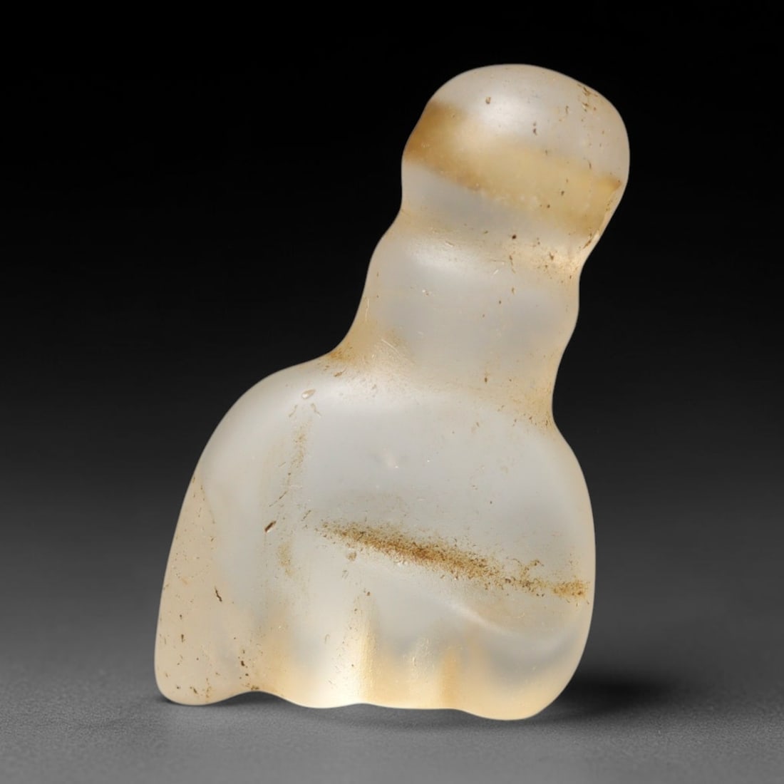 Ancient Medieval Coptic Christian Egyptian Culture Rock Crystal Fist Amulet (300-1000 CE), 1FV: This antique rock crystal amulet originates from Coptic Christian Egyptian Culture, where translucent hardstone talismans were widely fashioned for personal devotion and burial customs throughout late