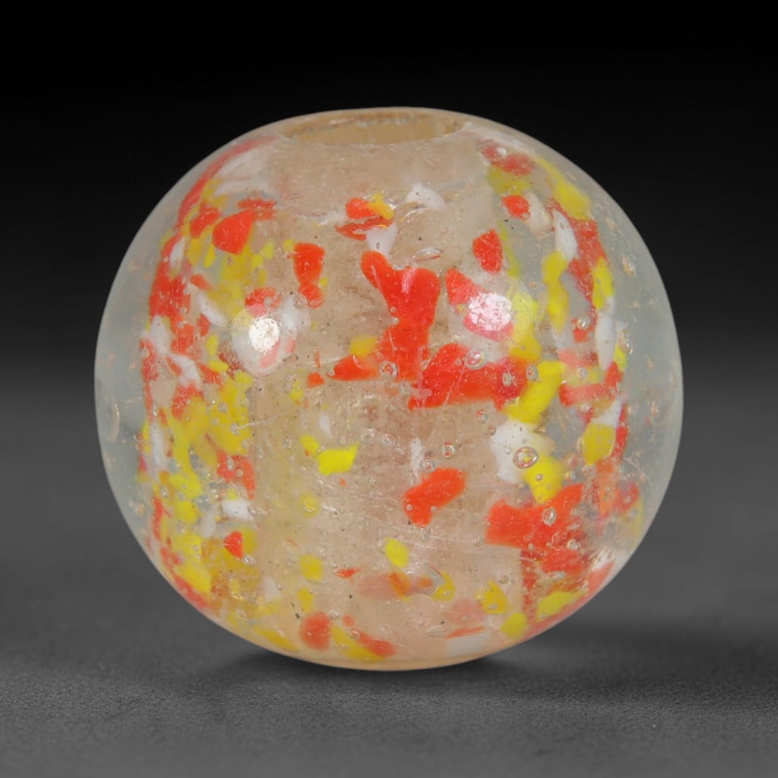 Vintage Confetti Speckled Blown Glass Bead - Handmade Spherical Ornament, 30AE: This rounded spherical bead is hand-blown from clear translucent glass embedded with scattered fragmented confetti inclusions of bright red, lemon yellow and opaque white glass flecks suspended throug