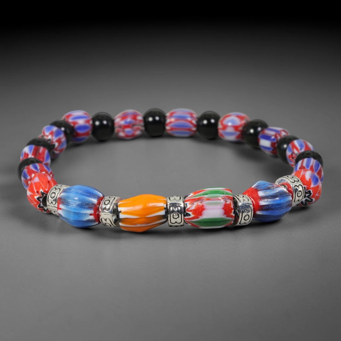 Vintage Millefiori Chevron Glass Mixed-Bead Bracelet, 55EK: Decorative bracelet composed of millefiori patterned glass beads, contrasting solid-tone beads and ornate metal spacer accents. Bead size measures 8.8mm. Strung into a flexible wearable strand suited 
