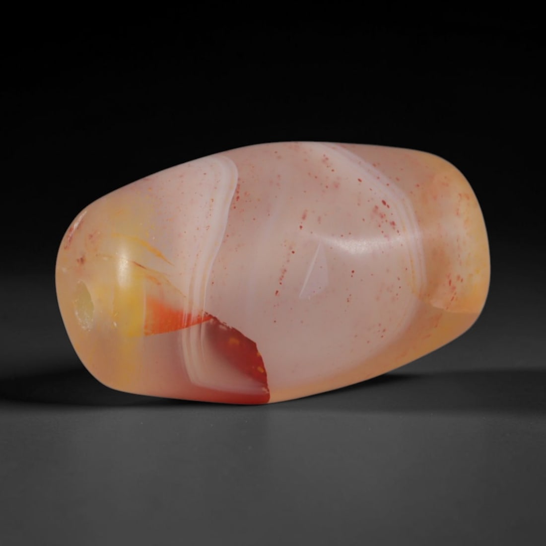 Ancient Bactrian Bronze Age Culture Banded Agate Barrel Bead (2200-1500 BCE), 61AD: This antique banded agate barrel bead originates from the ancient Bactrian Bronze Age Culture, a Central Asian lapidary tradition that produced fine agate beads for interregional exchange between the 