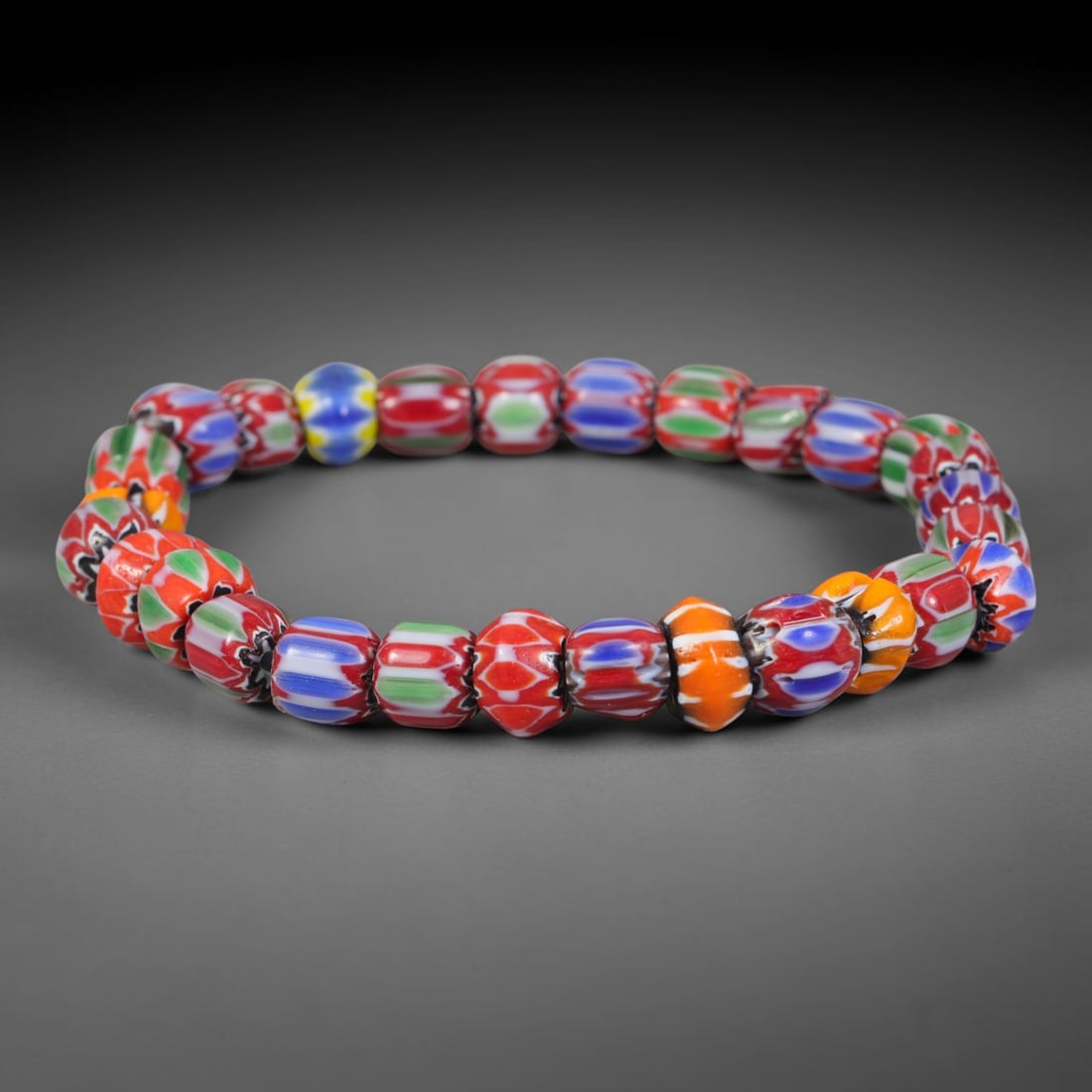 Vintage Millefiori Chevron Patterned Glass Bead Bracelet, 50EK: Hand-assembled bracelet composed of multi-colored millefiori glass beads. Bead size measures 7.9mm. Smooth finished beads form a flexible wearable strand, perfect for everyday wear and glass-bead coll