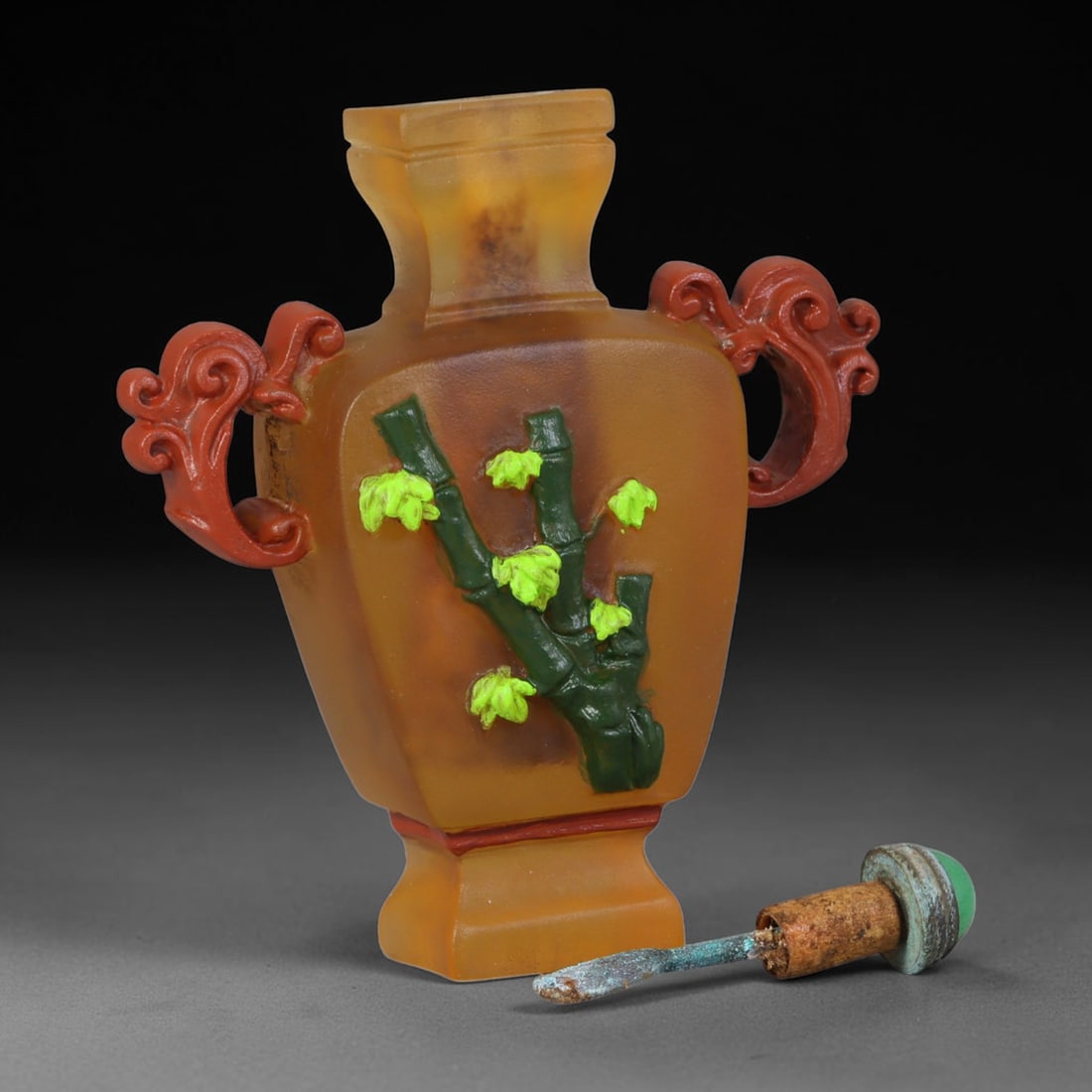 Vintage Chinese Liuli Glass Snuff Bottle - Bamboo Relief Vase, 59AS: This snuff bottle is formed from frosted amber liuli glass, shaped as a square vase fitted with paired scroll handles in red glass overlay. The front features applied relief carving of bamboo stalks w