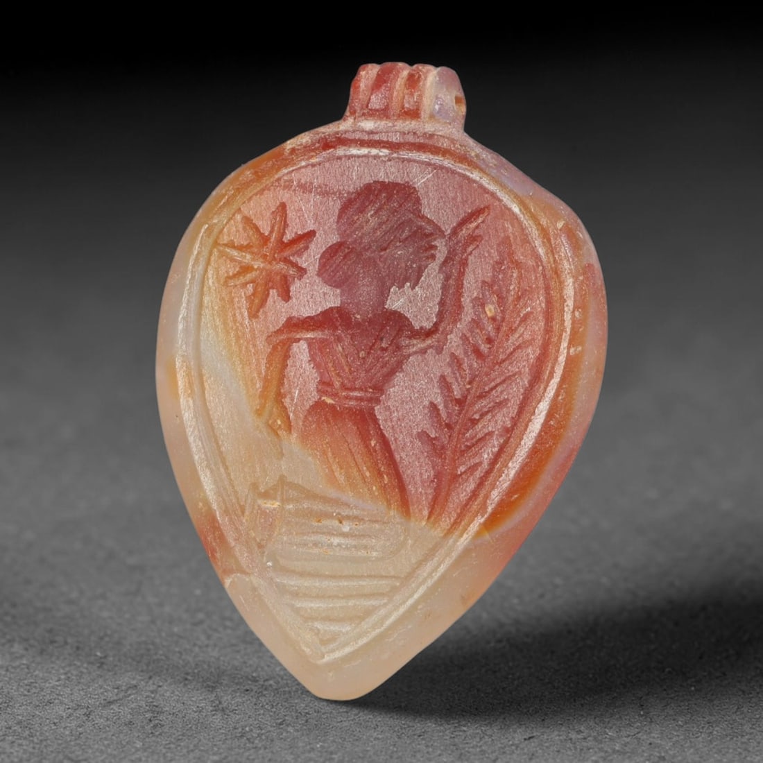 Vintage Natural Carnelian Agate Revival Indo-Persian Glyptic Figural Talisman Amulet Plaque, 7FL: This vintage talisman pendant plaque is skillfully carved from natural banded carnelian agate, crafted in a style referencing ancient Indo-Persian glyptic art traditions. The face bears detailed relie