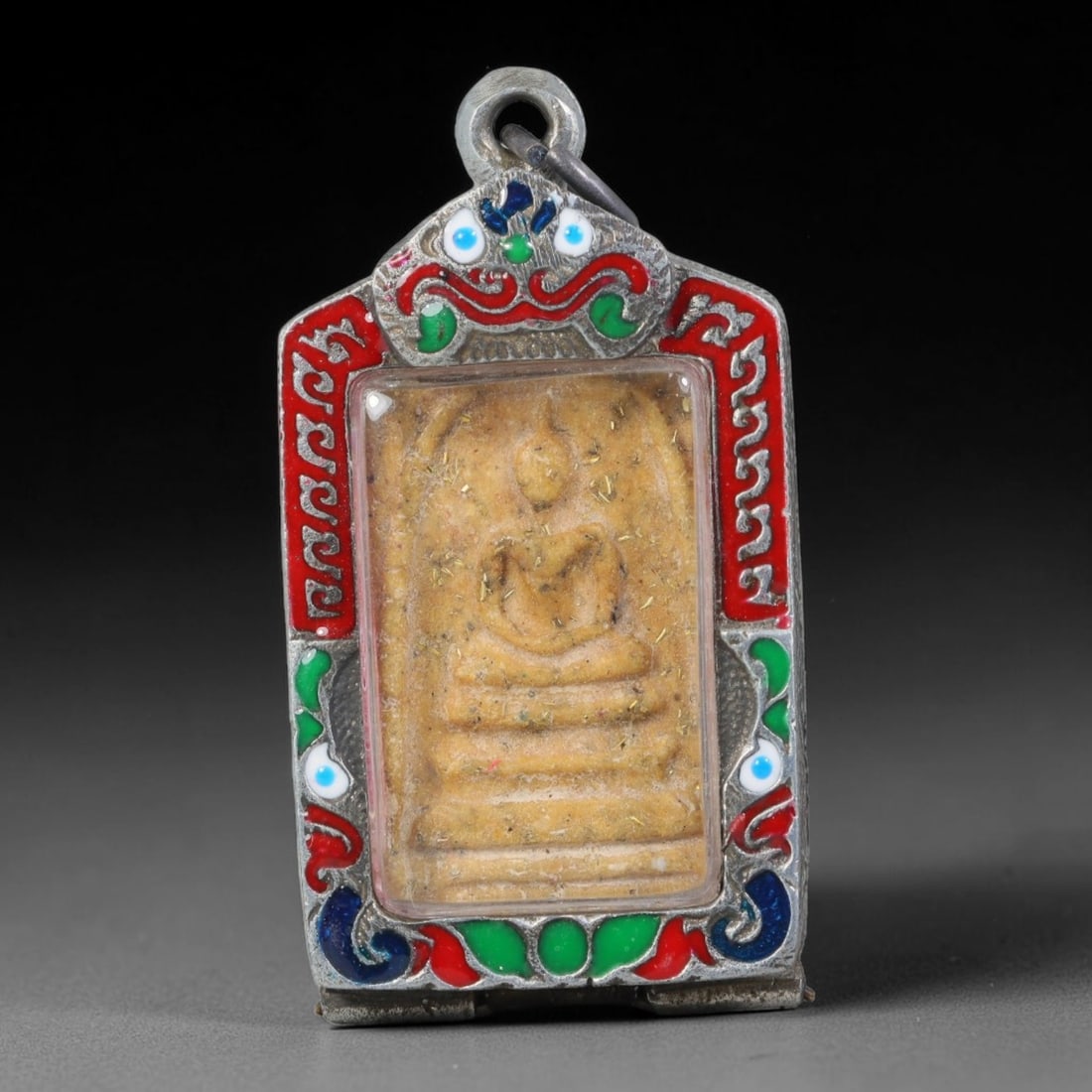 Vintage Thai Amulet Pendant - Rectangular Buddha Talisman Color Enamel Silver Alloy Casing, 91AA: Vintage rectangular Thai clay amulet measuring 6cm x 3.2cm, molded with embossed seated Buddha resting on tiered stepped pedestal, the pale sandy clay tablet dusted with fine gold leaf flecks and mark