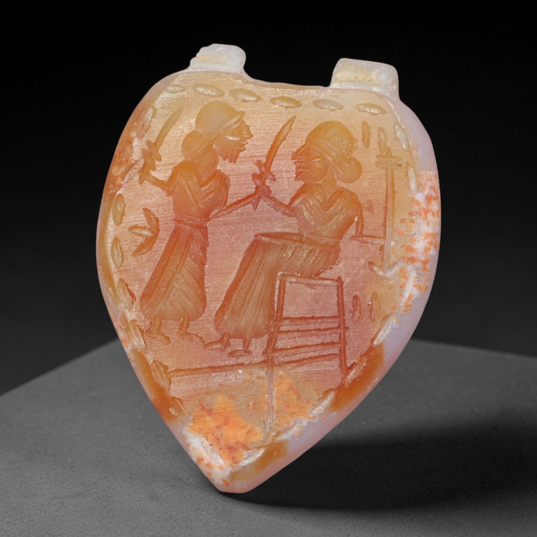 Vintage Natural Carnelian Agate Revival Indo-Persian Glyptic Figural Talisman Amulet Plaque, 38FK: This vintage talisman pendant plaque is skillfully carved from natural banded carnelian agate, crafted in a style referencing ancient Indo-Persian glyptic art traditions. The face bears detailed relie