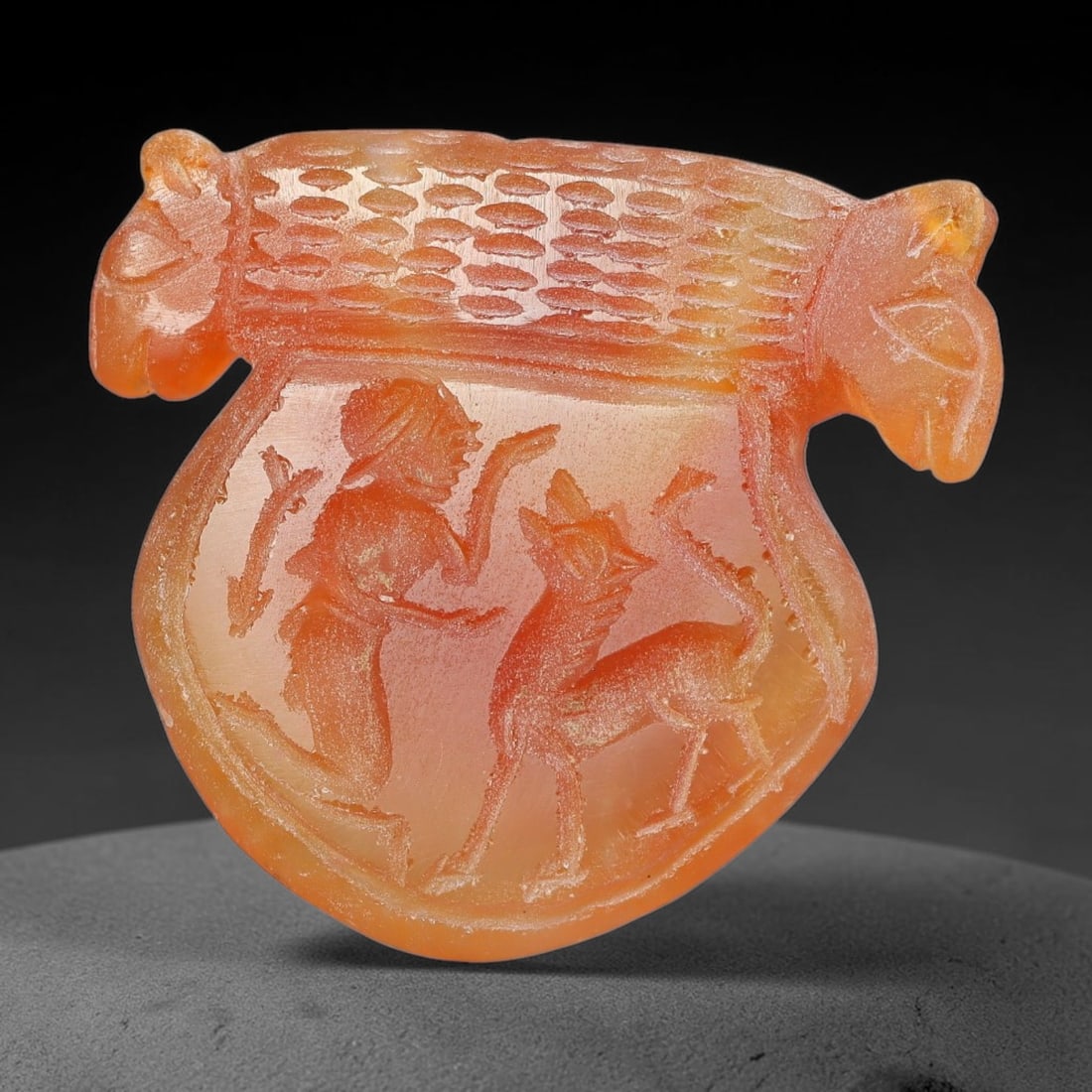 Vintage Natural Carnelian Agate Revival Indo-Persian Glyptic Figural Talisman Amulet Plaque, 10FK: This vintage talisman pendant plaque is skillfully carved from natural banded carnelian agate, crafted in a style referencing ancient Indo-Persian glyptic art traditions. The face bears detailed relie