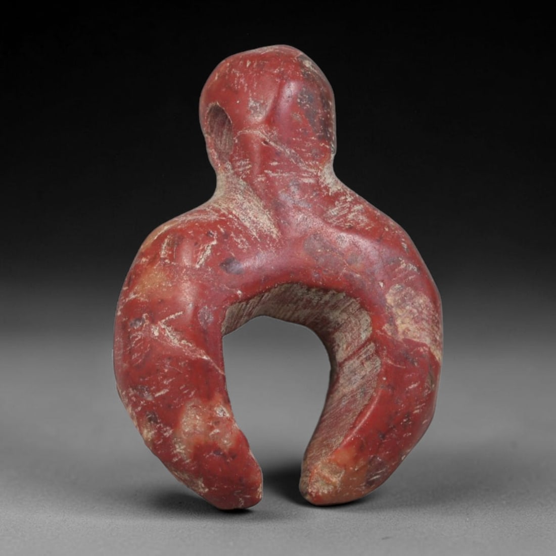 Ancient Coptic Egyptian Red Jasper Stylized Human Form Amulet, 81AA: Genuine ancient Coptic Egyptian spiritual talisman hand-carved from natural red jasper stone, measuring 2cm x 1.5cm. This distinctive miniature carving features a simplified hooded human upper torso w