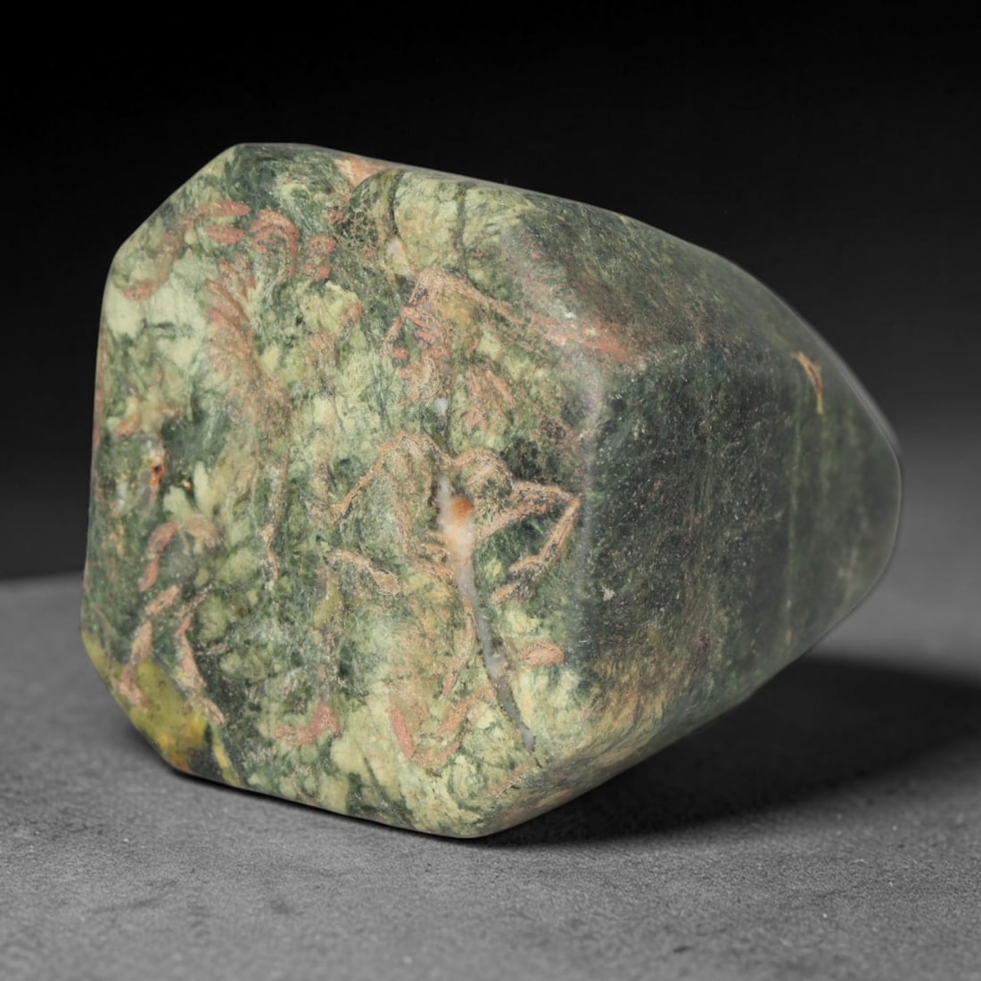 Ancient Medieval Early Islamic Period Variegated Green Stone Conoid Stamp Seal (c.7th-11th Century: This tapered conoid stamp seal is carved from naturally mottled green stone, decorated with finely incised figural motifs. The surface bears ancient mineral staining, natural veining and soft wear acc
