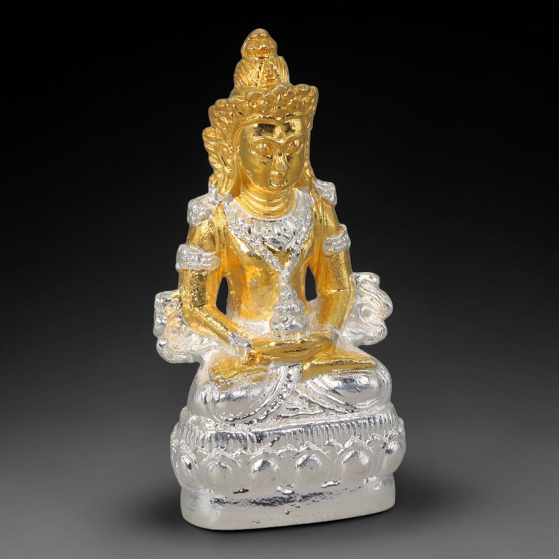 Thai Two-Tone Metal Mini Sacred Statuette Amulet, 1AH: Small cast metal sacred figurine crafted with layered sculpted decorative detailing across the body, ornate head adornment and tiered pedestal base. Distinct contrasting metallic finishes cover differ