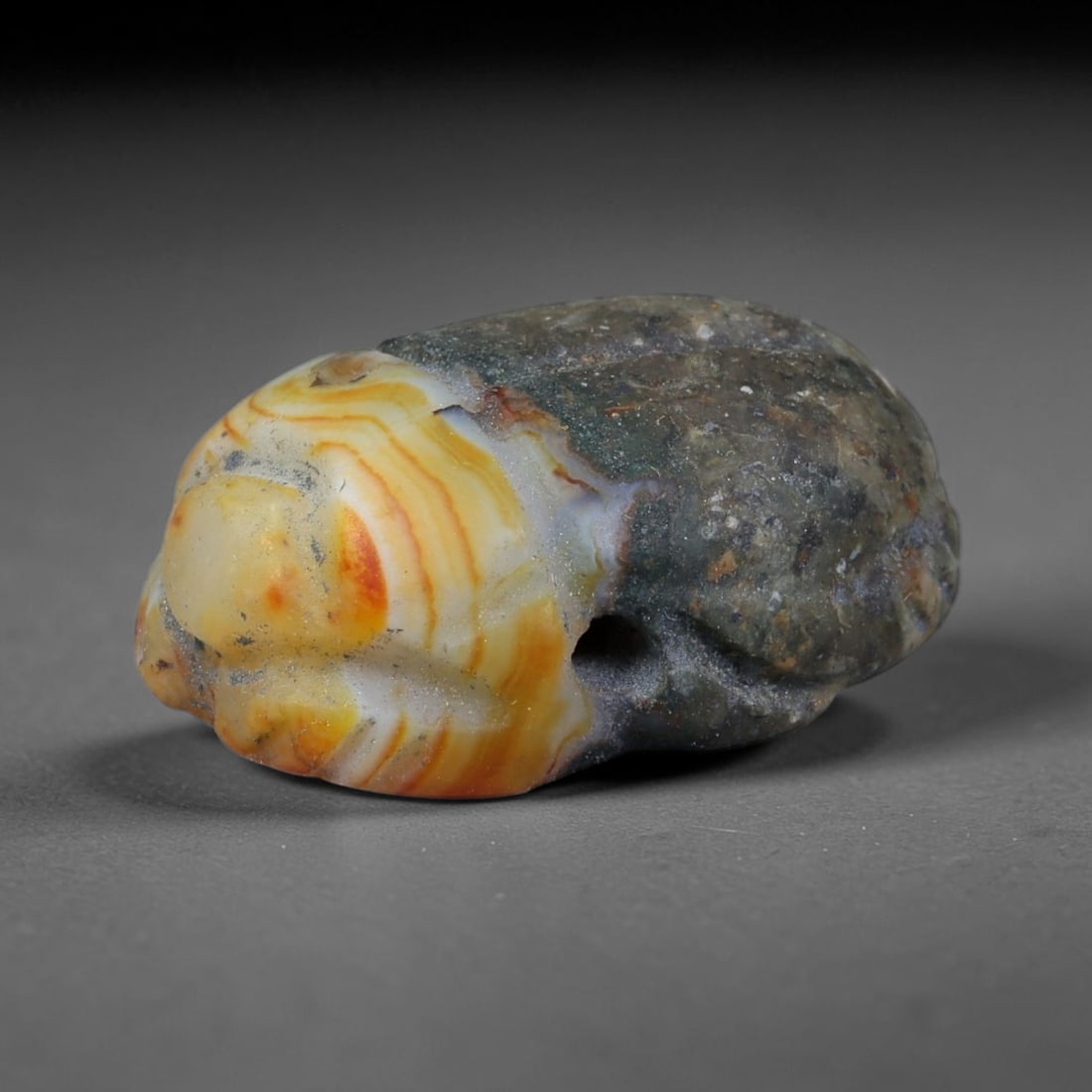 Ancient Pharaonic Egyptian Agate Scarab Amulet Bead (3100 BCE-30 CE), 36FV: This antique scarab amulet bead is carved from natural agate, originating from Pharaonic Egyptian culture. Scarabs were sacred protective talismans closely linked to rebirth and eternal life within an