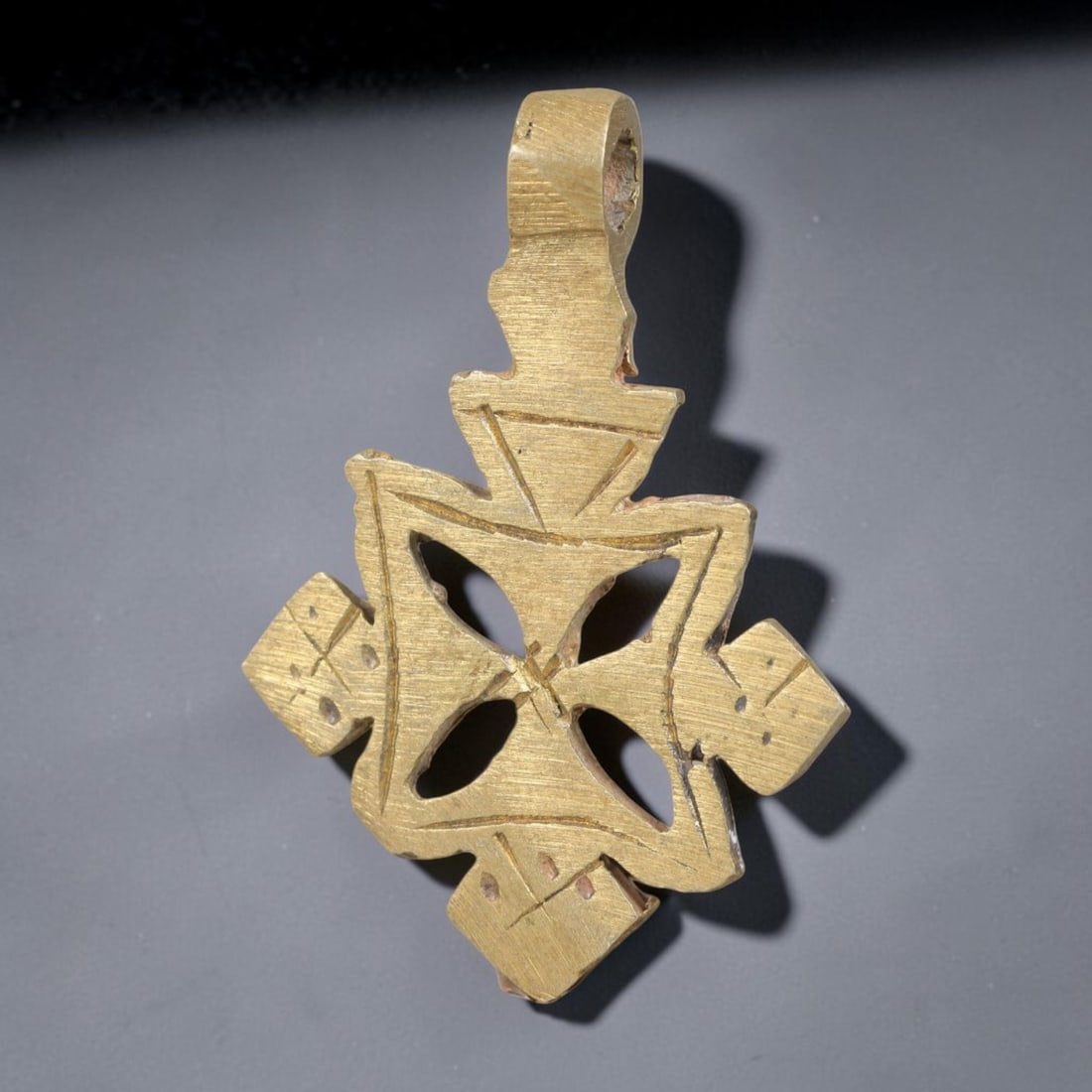 Vintage Ethiopian Copper Alloy Cross Pendant, 25EJ: Crafted from copper alloy, this traditional Ethiopian cross pendant features integrated suspension loop for wear. Shows authentic surface patina consistent with vintage origin. Dimensions: 4.3x3cm. So