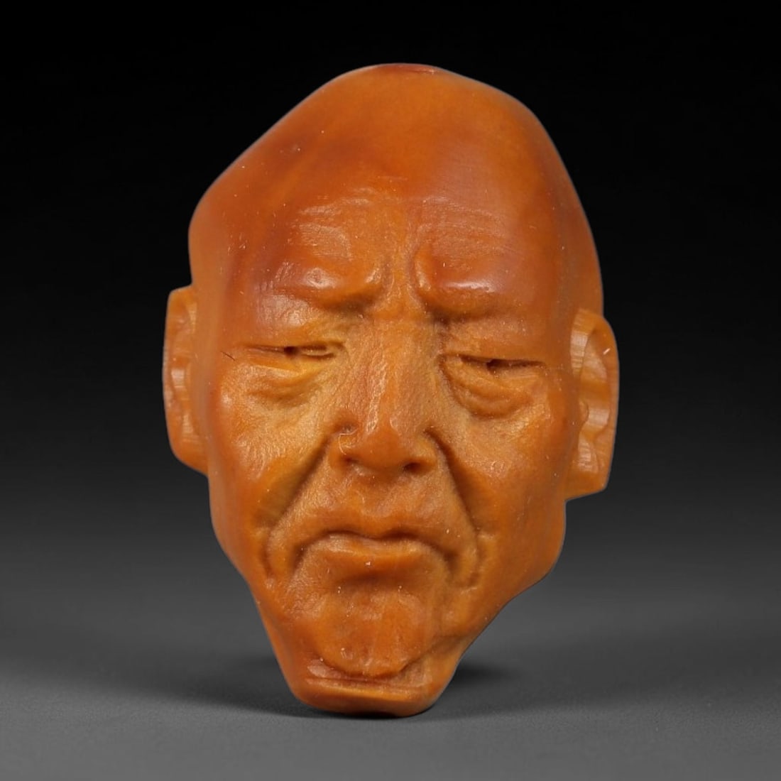 A Chinese Carved Natural Olive Nut Drilled Art Bead, 50BZ: Traditional craft bead carved from solid natural olive nut core, representing a classic miniature Chinese micro-carving folk art piece with a pre-drilled suspension bore integrated for easy threading 