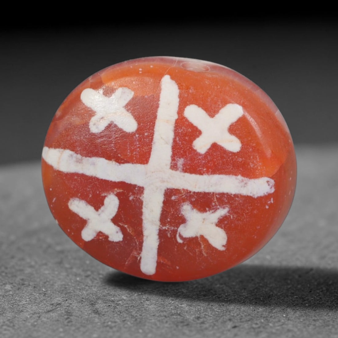 Antique Sino-Himalayan Region Etched Carnelian Bead, 5EH: Antique etched carnelian bead originating from the Sino-Himalayan region. Exhibits characteristic surface patina and traditional etched white decoration. Dimensions: 15x13mm, fully pierced for suspens