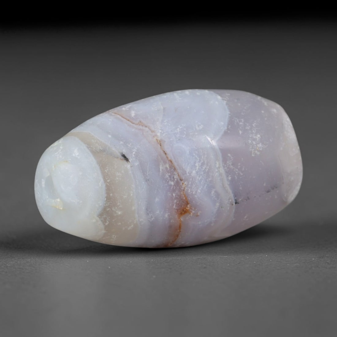 Ancient Urartu Iron Age Kingdom Banded Agate Barrel Bead (860-585 BCE), 75AD: This antique banded agate barrel bead originates from the Urartu Iron Age Kingdom of the Armenian Highlands, a mountain civilization celebrated for sophisticated regional lapidary traditions creating 