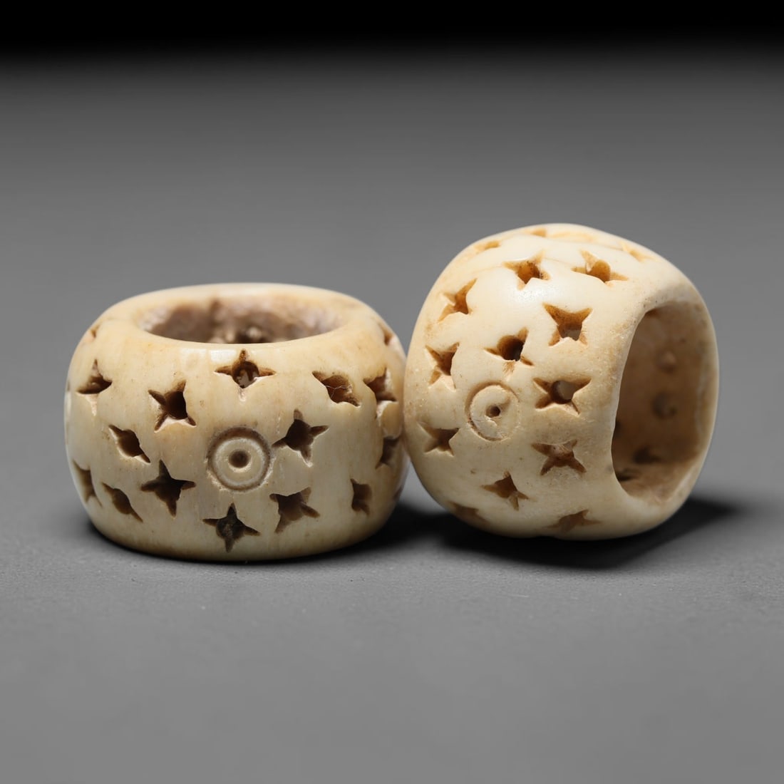 Antique Sino-Siberian Steppe Nomadic Craft Stag Antler Carved Bead Pair (Post 1850s), 31FV: Pair of beads skillfully carved from natural stag antler, originating from Sino-Siberian Steppe Nomadic craft traditions, produced post 1850s. The antler material holds attractive natural aged patina,