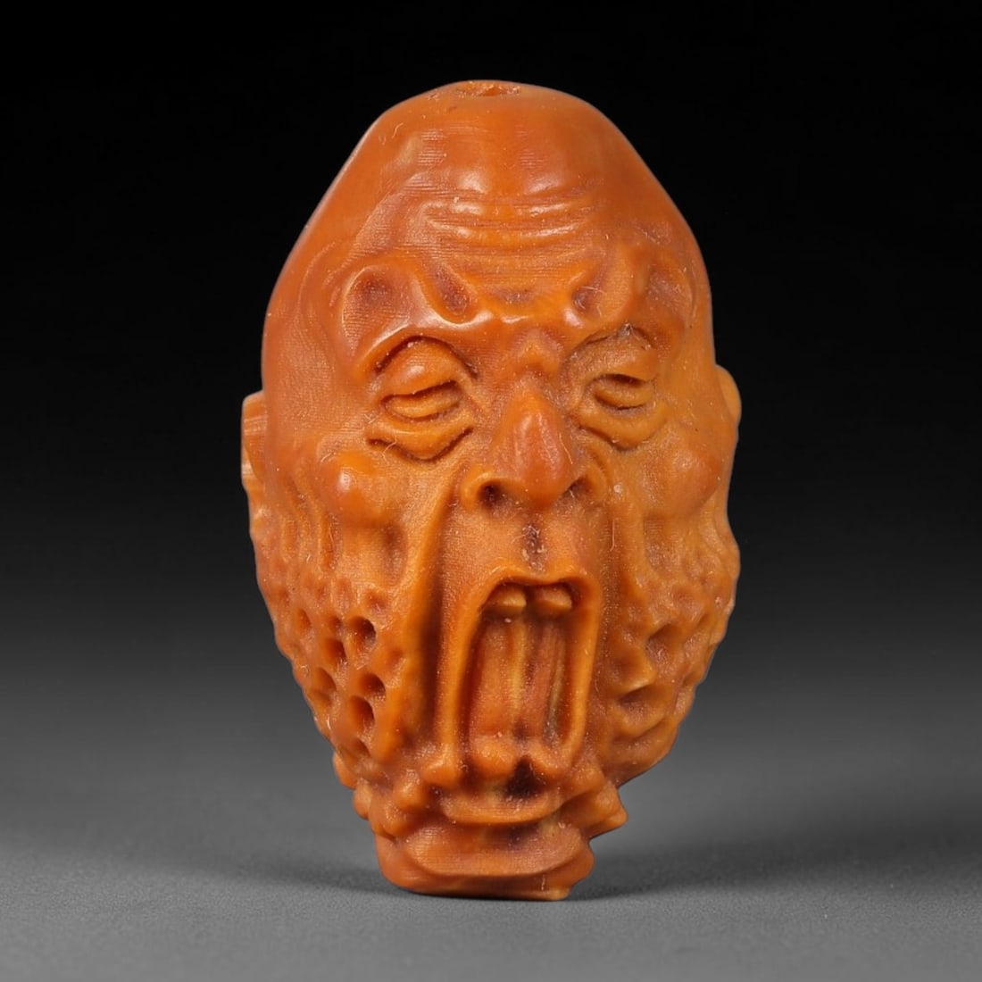 A Chinese Carved Natural Olive Nut Drilled Art Bead, 26BZ: Traditional craft bead carved from solid natural olive nut core, representing a classic miniature Chinese micro-carving folk art piece with a pre-drilled suspension bore integrated for easy threading 