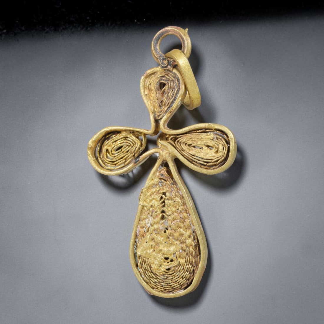 Vintage Ethiopian Copper Alloy Cross Pendant, 24EJ: Crafted from copper alloy, this traditional Ethiopian cross pendant features integrated suspension loop for wear. Shows authentic surface patina consistent with vintage origin. Dimensions: 4.5x2.5cm. 