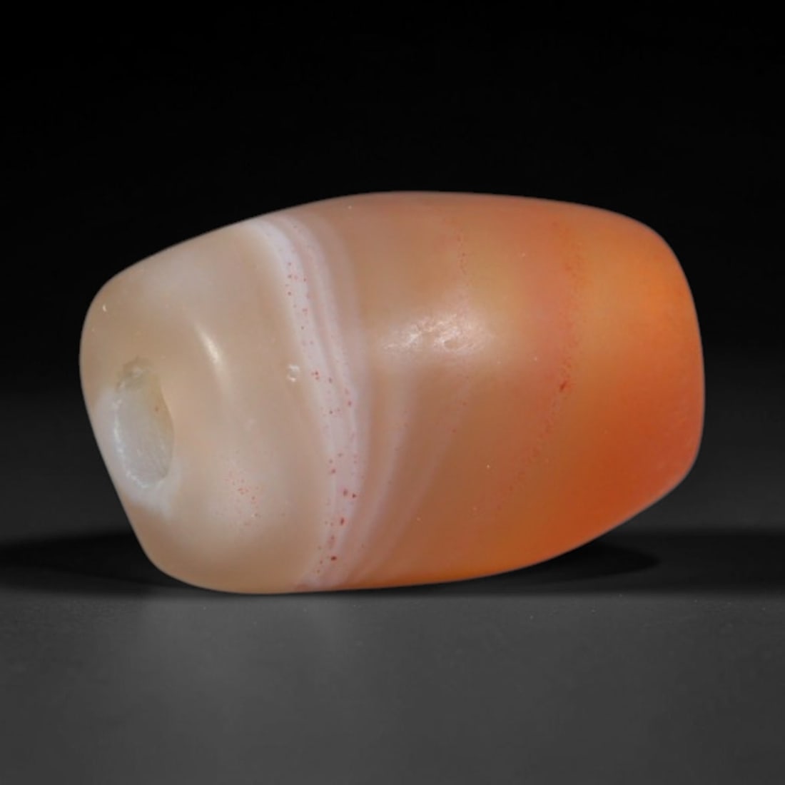 Ancient Canaanite & Phoenician Cultures Banded Agate Barrel Bead (3000-300 BCE), 25AD: This antique banded agate barrel bead originates from the Canaanite & Phoenician Cultures, maritime Levantine artisans that produced and traded banded chalcedony beads across the Mediterranean while a