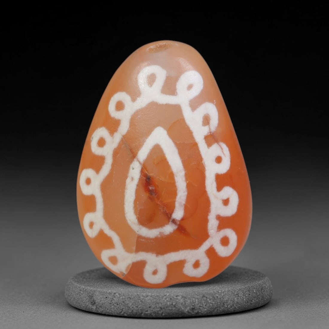 Antique Sino-Himalayan Region Etched Carnelian Bead, 89EG: Antique etched carnelian bead originating from the Sino-Himalayan region. Exhibits characteristic surface patina and traditional etched white decoration. Dimensions: 15x11mm, fully pierced for suspens