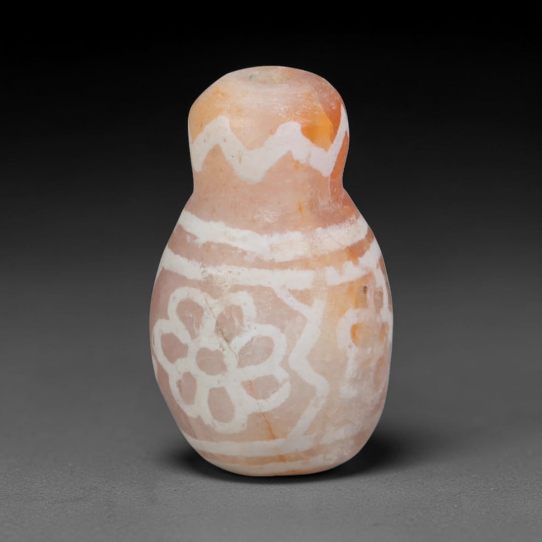 Antique Sino-Himalayan Region Etched Carnelian Bead, 3EH: Antique etched carnelian bead originating from the Sino-Himalayan region. Exhibits characteristic surface patina and traditional etched white decoration. Dimensions: 17x10mm, fully pierced for suspens