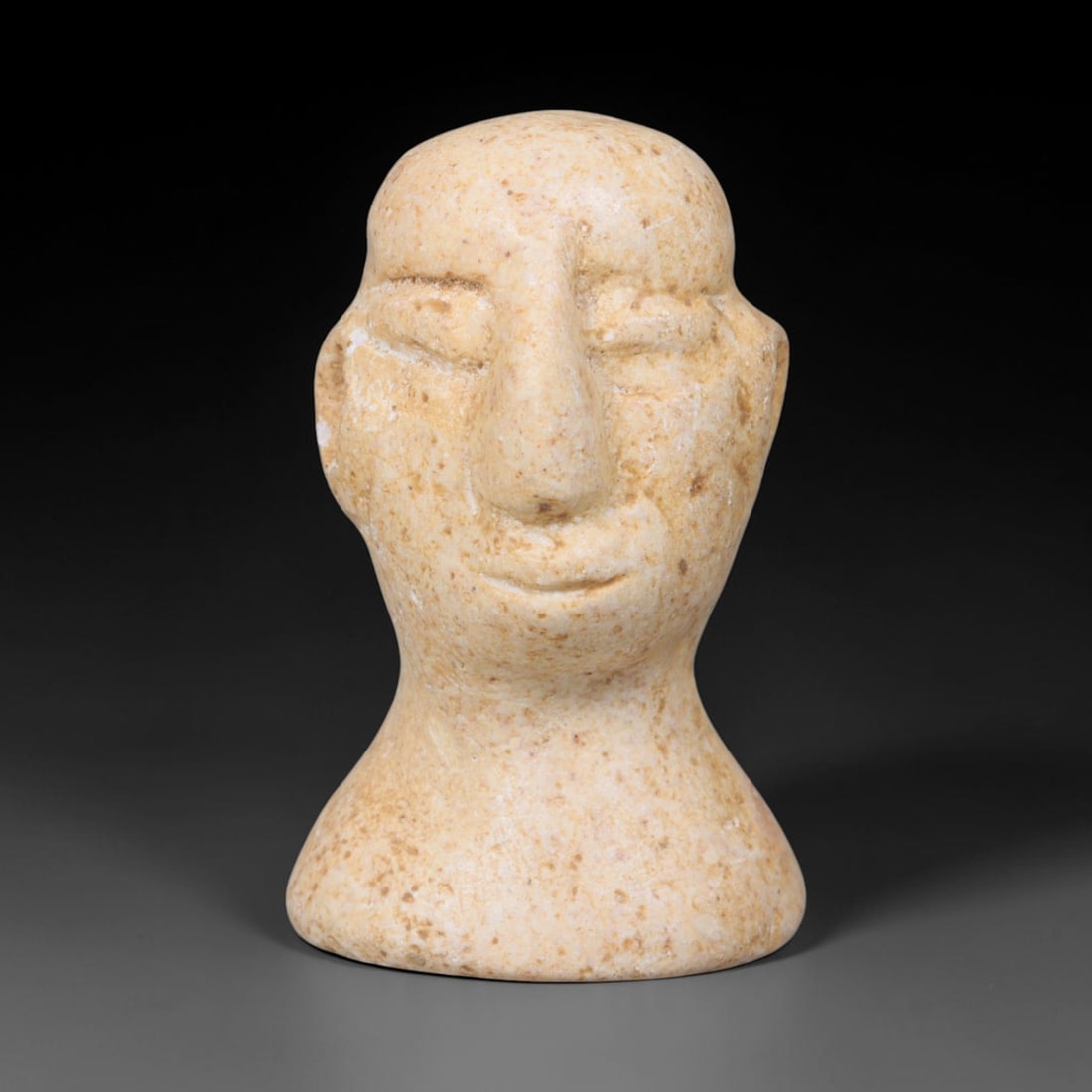 Ancient Bactrian Marble Idol Head (250 BCE-200 CE), 82EQ: This carved pale marble idol head originates from Greco-Bactrian Culture, a significant Silk Road civilization blending Hellenistic and Central Asian artistic traditions. The simplified facial feature