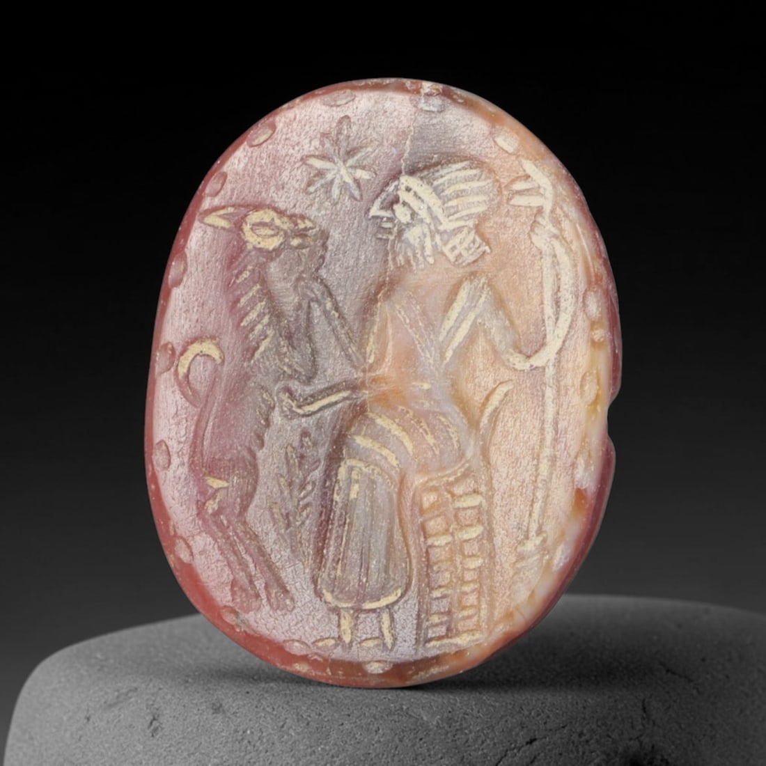 Ancient Sasanian Persian Carnelian Scarab Form Intaglio Stamp Seal (224-651 CE), 60EQ: This wearable stamp seal is crafted from warm translucent carnelian originating from the Sasanian Persian Empire, shaped in scarab beetle form with finely carved segmented dorsal shell detailing on th