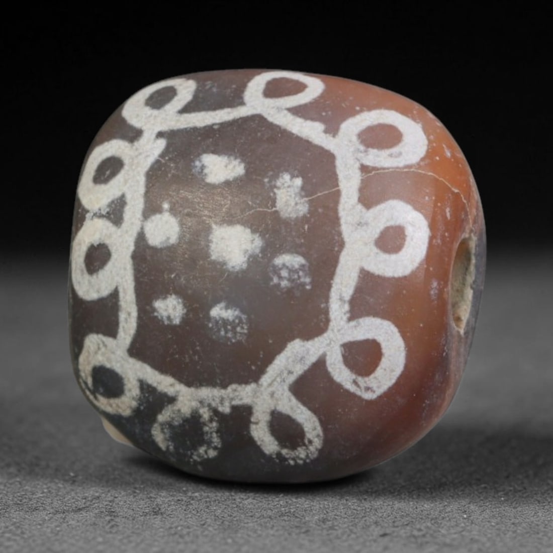 Antique Sino-Himalayan Region Etched Carnelian Bead, 72EG: Antique etched carnelian bead originating from the Sino-Himalayan region. Exhibits characteristic surface patina and traditional etched white decoration. Dimensions: 12x11mm, fully pierced for suspens