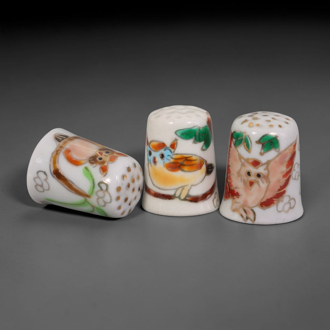Vintage Hand-Painted Porcelain Thimble Set of 3 - Owl & Bird Motif Sewing Collectibles, 15AR: This curated trio features three vintage fine white porcelain sewing thimbles, every piece individually hand-decorated with distinct avian illustrations enhanced by delicate gilded highlights and subt