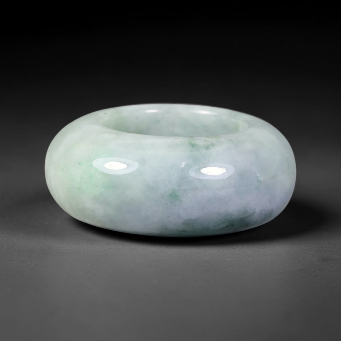 Natural Burmese Type A Jadeite Jade Wide Band Ring, 9BK: Polished untreated Burmese Type A jadeite jade wide band ring, US ring size 12 with a substantial band width of 14 mm. The jadeite features a soft pale mint green base naturally streaked with flowing 