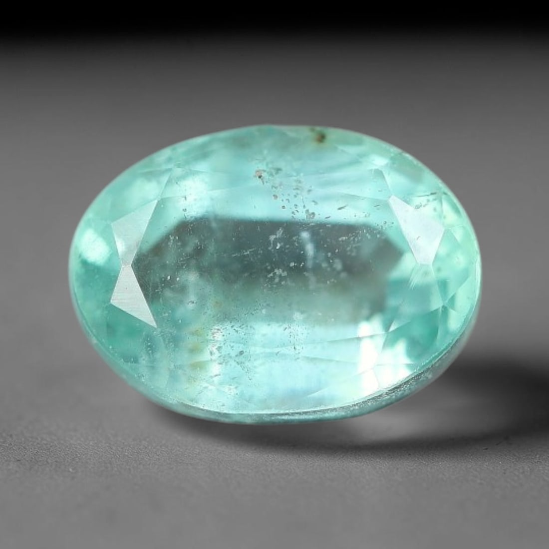 0.94 Carats Natural Zambian Green Emerald Loose Gemstone, 4FP: This green Zambian emerald holds smooth even saturation with subtle faint natural internal markings lending authentic organic character, measured at 7x5.1x3.8mm, its calm cool green tone delivers unde