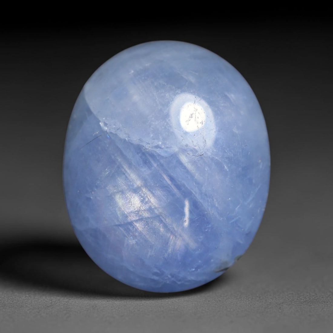 7.53ct Natural Unheated Burmese Blue Star Sapphire Oval Cabochon Loose Gemstone, 44BQ: This smoothly polished oval cabochon features natural Burmese blue star sapphire, formed with densely aligned rutile needle inclusions required to produce asterism. The gently domed surface is expertl