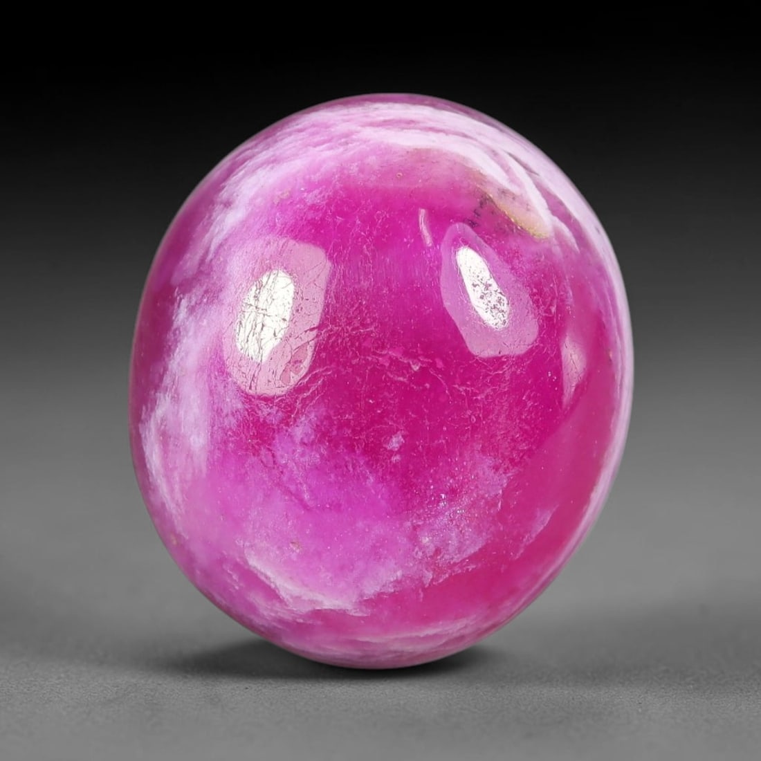 16.78 Carats Natural Mozambique Vivid Pink Red Ruby Loose Gemstone, 81FG: This polished Mozambique ruby cabochon measures 15.2x13.4x7mm, featuring striking natural swirling white mineral banding layered across a rich saturated pink red base that creates a unique organic art