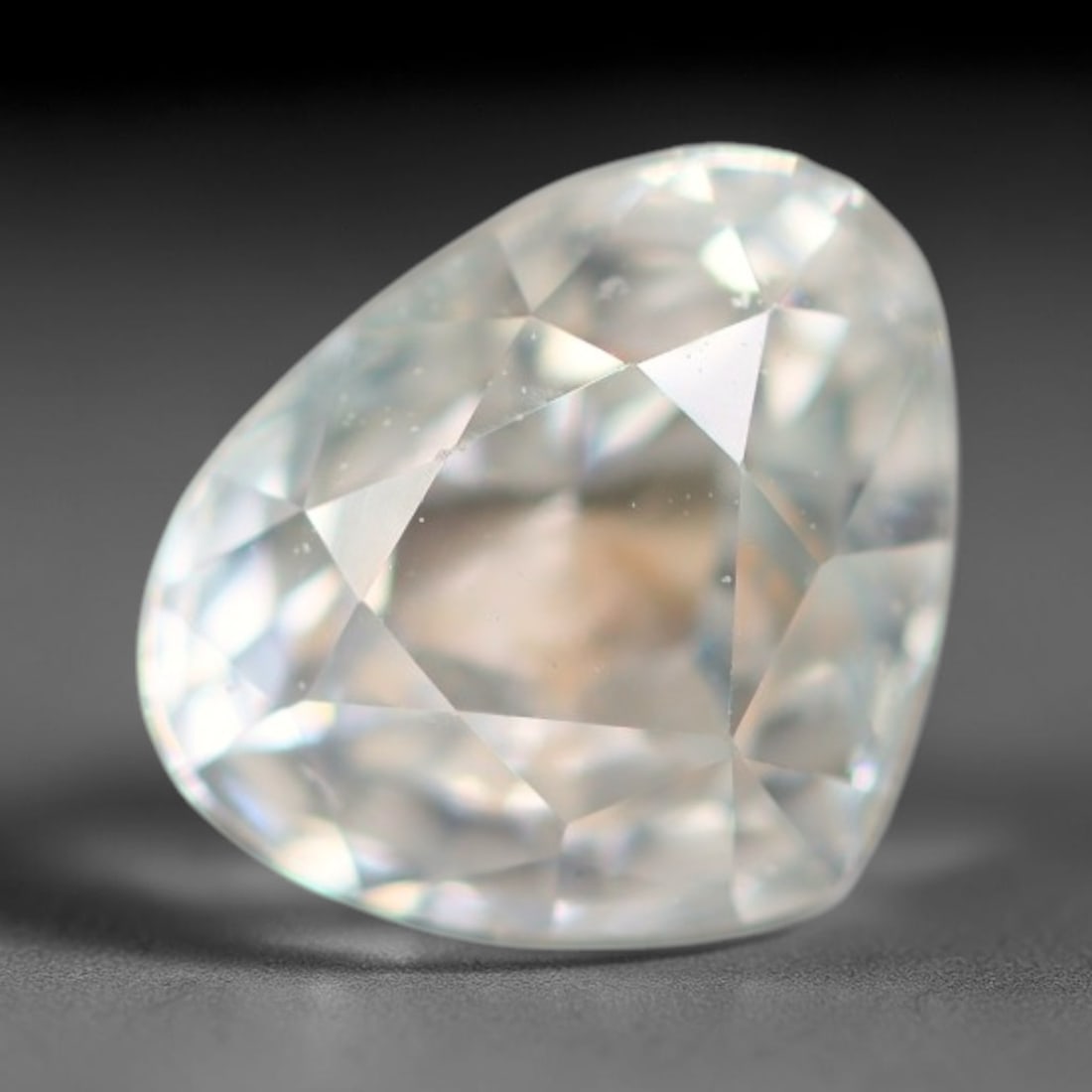 1.39ct Natural Cambodian White Zircon Loose Gemstone, 20BA: This fully polished Cambodian white zircon displays a crisp colorless transparent crystal body with faint microscopic mineral specks scattered within its high-refraction interior, measured at calibrat