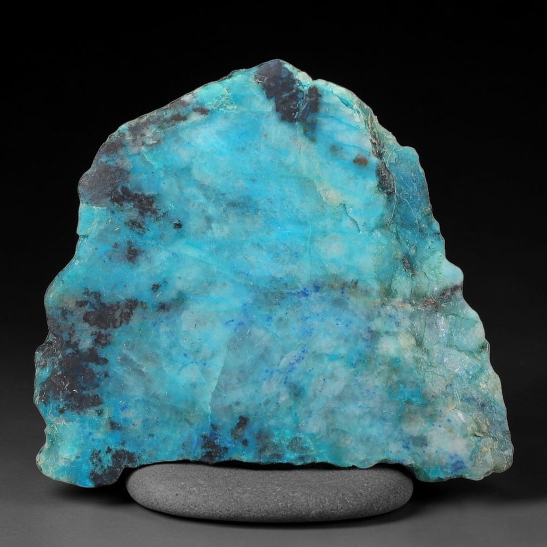 95ct Natural Peruvian Chrysocolla Polished Slab Rough, 73AR: This partial-polished chrysocolla slab features blended mineral matrix with smooth refined face and unaltered natural rugged edge across its 37x31x8mm elongated form, translucent mineral layers hold s