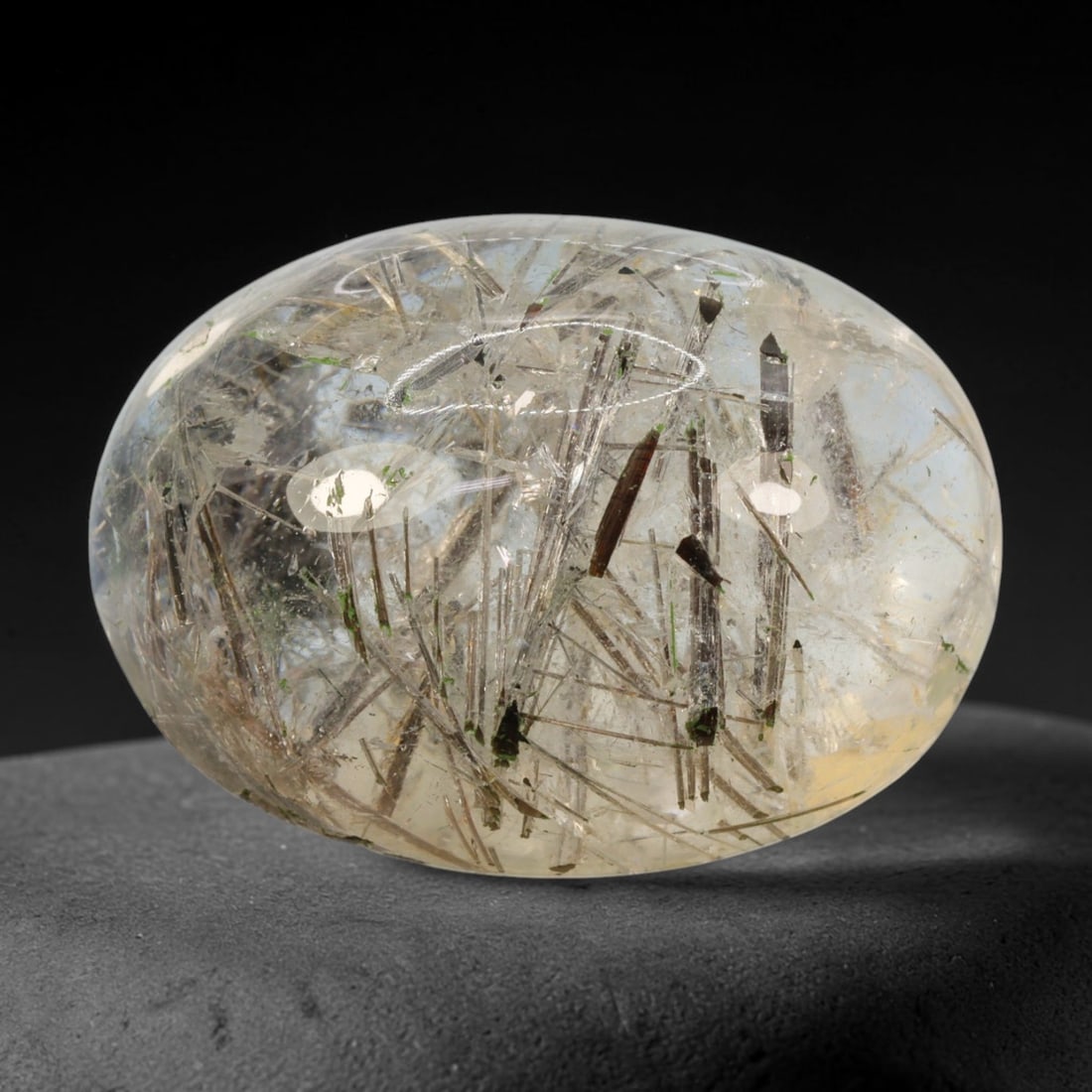 31ct Natural Brazilian Black Rutile Quartz Cabochon Loose Gemstone, 69BM: This polished cabochon of natural rutile quartz features countless distinct slender black rutile needle inclusions suspended within the clear quartz host crystal. The smooth domed surface enables full