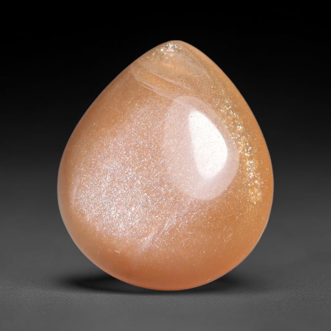 5.18ct Natural Ceylon Warm Peach Moonstone Loose Gemstone, 96FX: This natural Ceylon moonstone has dimension measurements of 14x12x4mm, showcasing a smooth warm peach base tone paired with subtle soft adularescent sheen that glides gently across the polished surfac