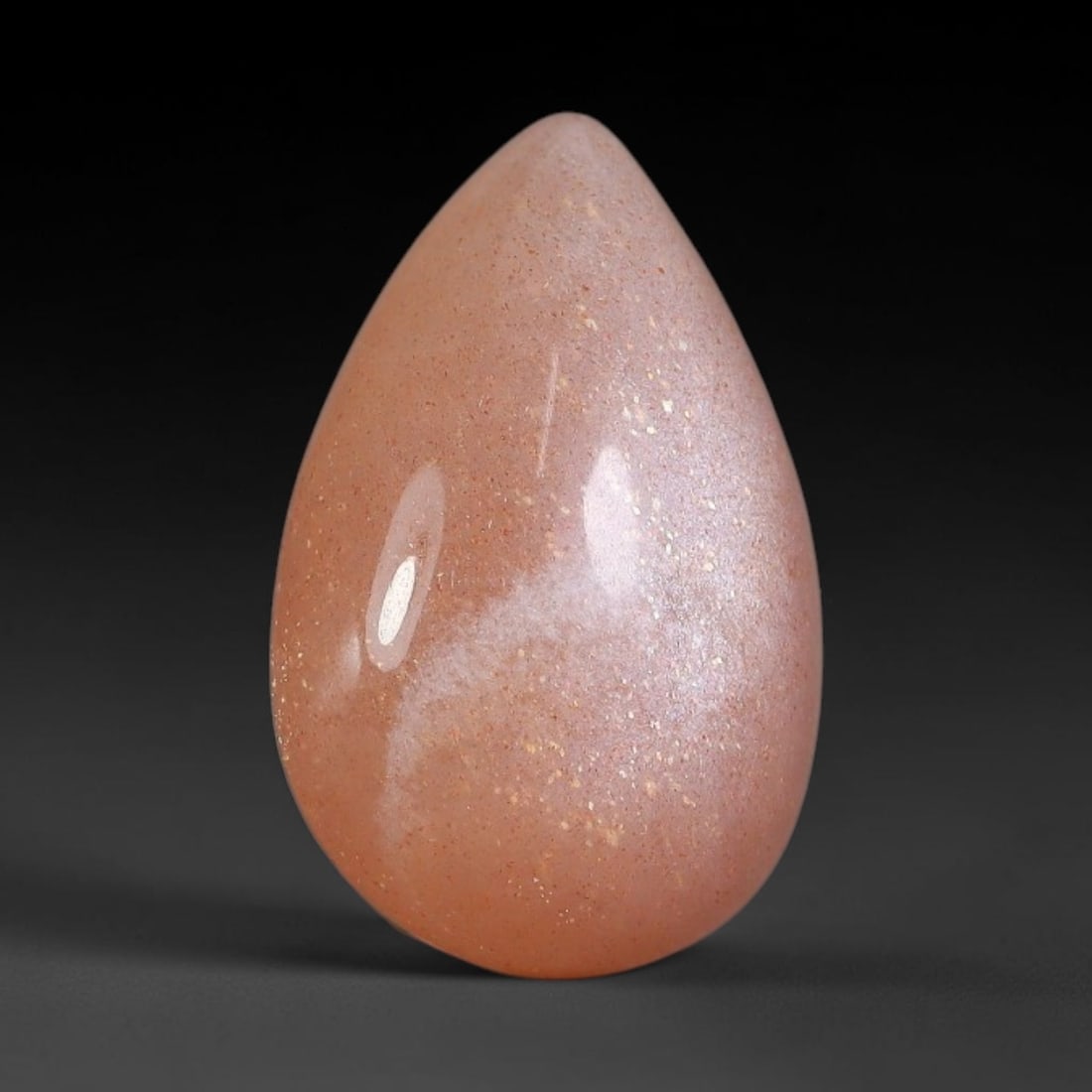8.67 Carats Natural Ceylon Soft Peach Pink Moonstone Cabochon Loose Gemstone, 100AB: This warm soft peach pink moonstone features delicate sparkling mineral flecks scattered throughout its smooth surface paired with faint flowing adularescent glow, measured at 17.8x11.7x6.1mm, its gen