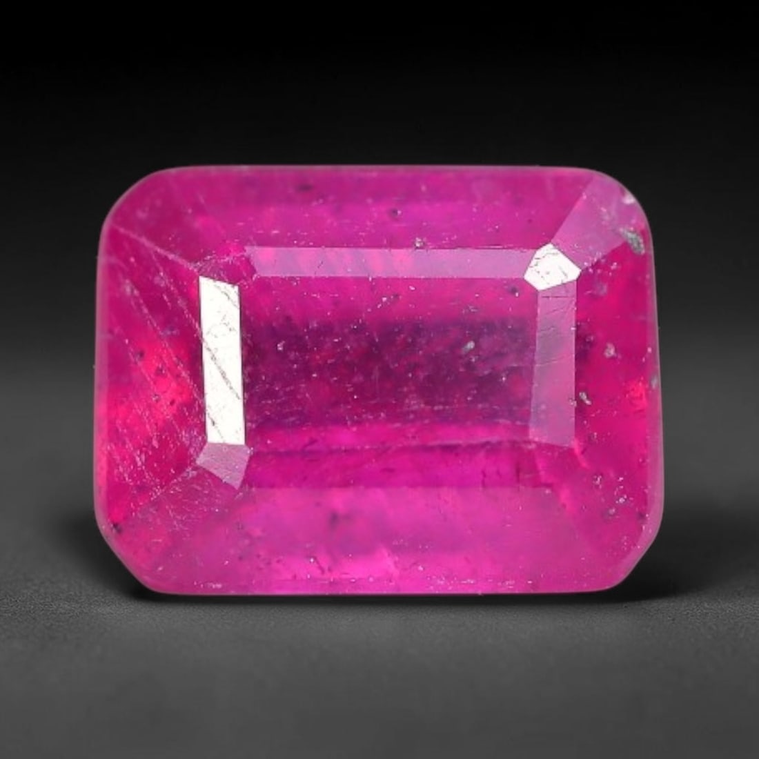 1.51 Carats Natural Madagascar Vivid Fuchsia Red Heated Ruby Loose Gemstone, 45FM: This vivid fuchsia red Madagascar ruby displays rich saturated red tone with subtle natural internal mineral traces that showcase genuine earth-grown character, measured at 6.8x3.6mm, the intense warm