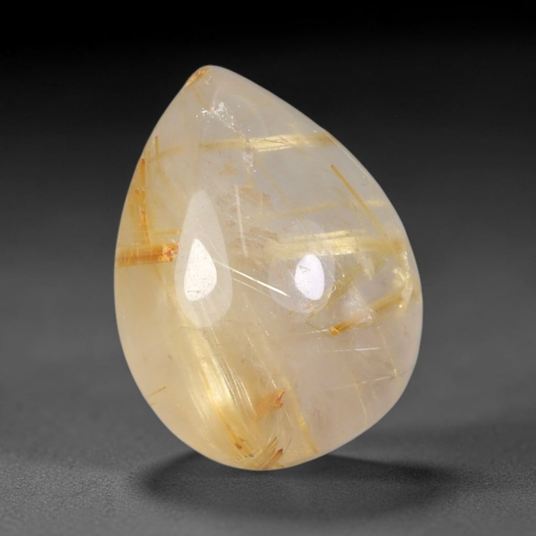 8.73 Carats Natural Brazil Golden Needle Rutile Quartz Loose Gemstone, 74FM: This Brazil golden needle rutile quartz cabochon measures 15.3x11.9x6.7mm, featuring prominent bright golden rutile needle inclusions scattered naturally throughout its clear transparent quartz base, 