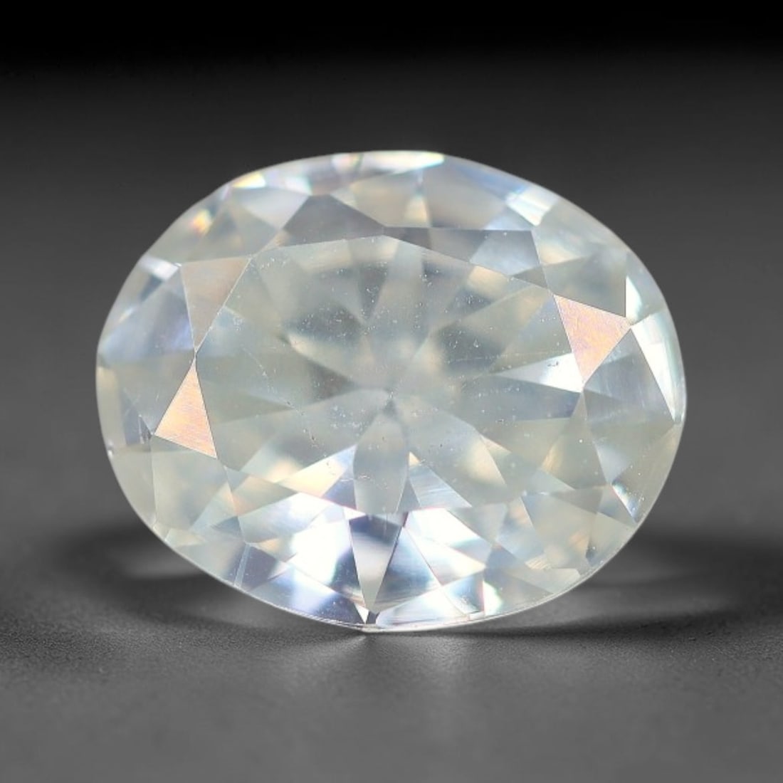 1.00 Carats Natural Cool White Moissanite Loose Gemstone, 94FM: This cool white moissanite holds dimension measurements of 8x6.7x3mm, delivering exceptional light dispersion that generates vivid rainbow sparkle across its fully transparent body, with faint microsc