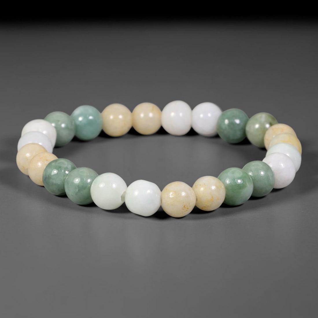 Natural Burmese Type A Jadeite Jade Beaded Bracelet, 23FJ: Constructed from polished natural jadeite jade round beads paired with decorative accent elements. The bracelet measures 8cm, assembled as a flexible wearable strand. Simple and elegant, suitable for 