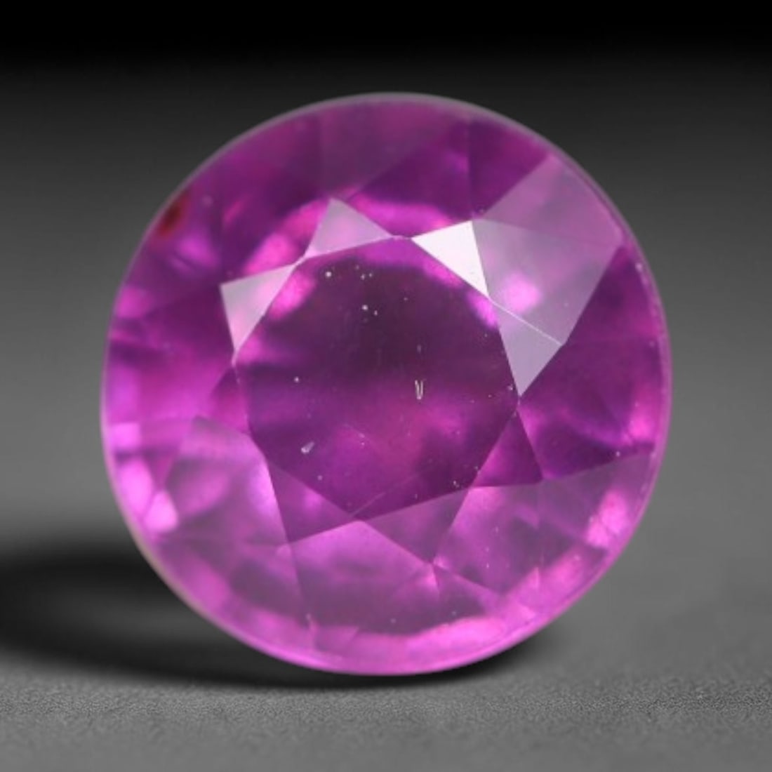 1.46ct Natural Tanzanian Rhodolite Grape Garnet Faceted Loose Gemstone, 92BA: This expertly faceted grape garnet, a scarce saturated purple-magenta rhodolite variant, features transparent crystal structure dotted with faint microscopic mineral specks within its precisely cut re