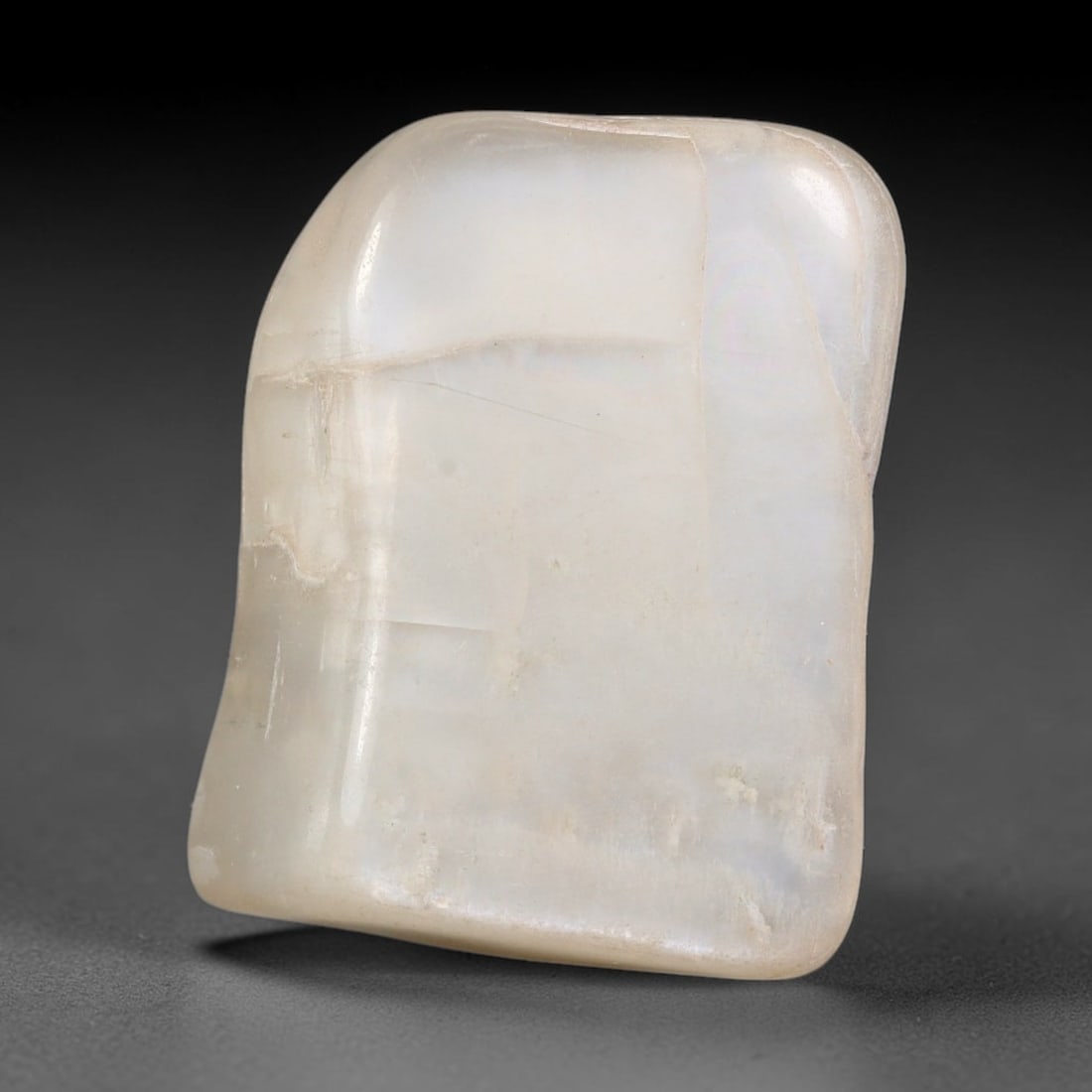53ct Natural Ceylon Pale Cream White Moonstone Rough, 63AH: This smooth weathered moonstone rough carries soft pale cream white translucency with subtle internal silvery adularescent shimmer locked within its naturally tumbled surface, fine faint mineral veini