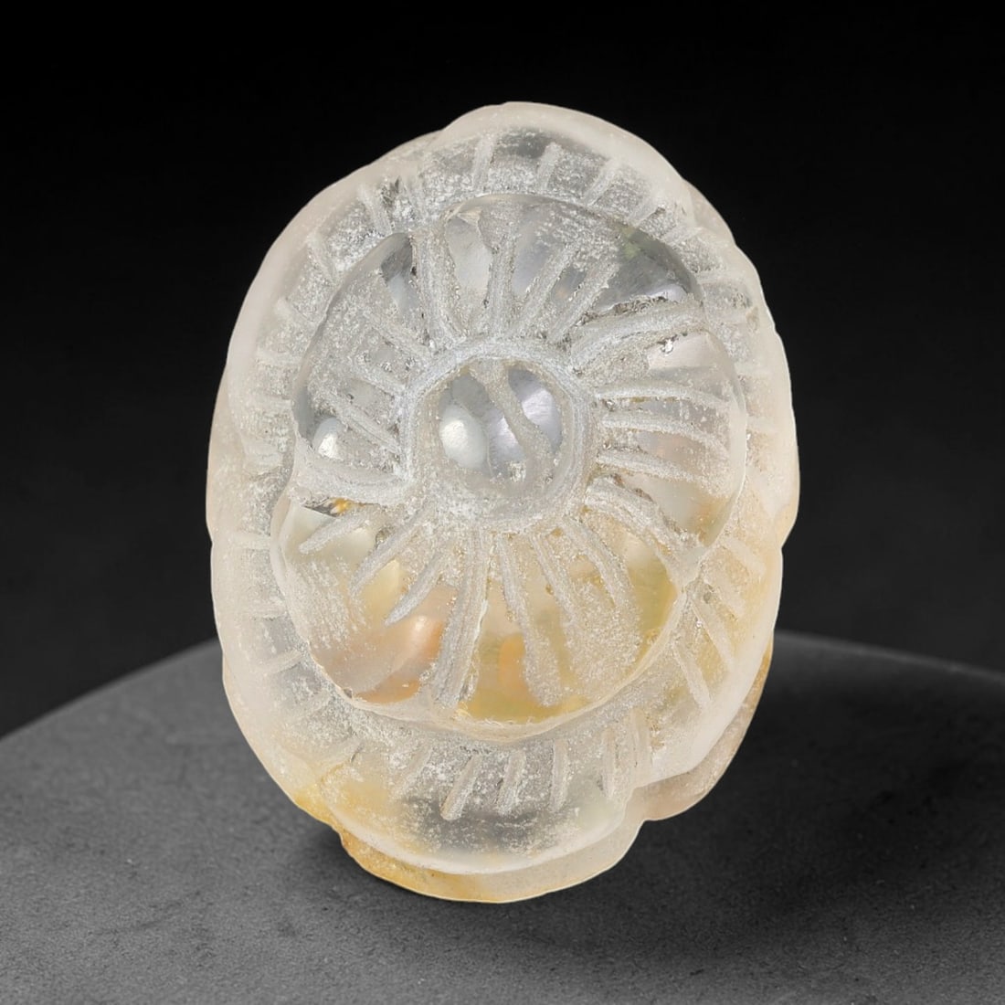 Natural Brazilian Phantom Quartz Hand Carved Floral Gemstone, 46BS: This hand-carved floral specimen is crafted from natural phantom quartz. Intricate layered floral detailing wraps across the stone's surface, while translucent quartz matrix reveals subtle internal ph