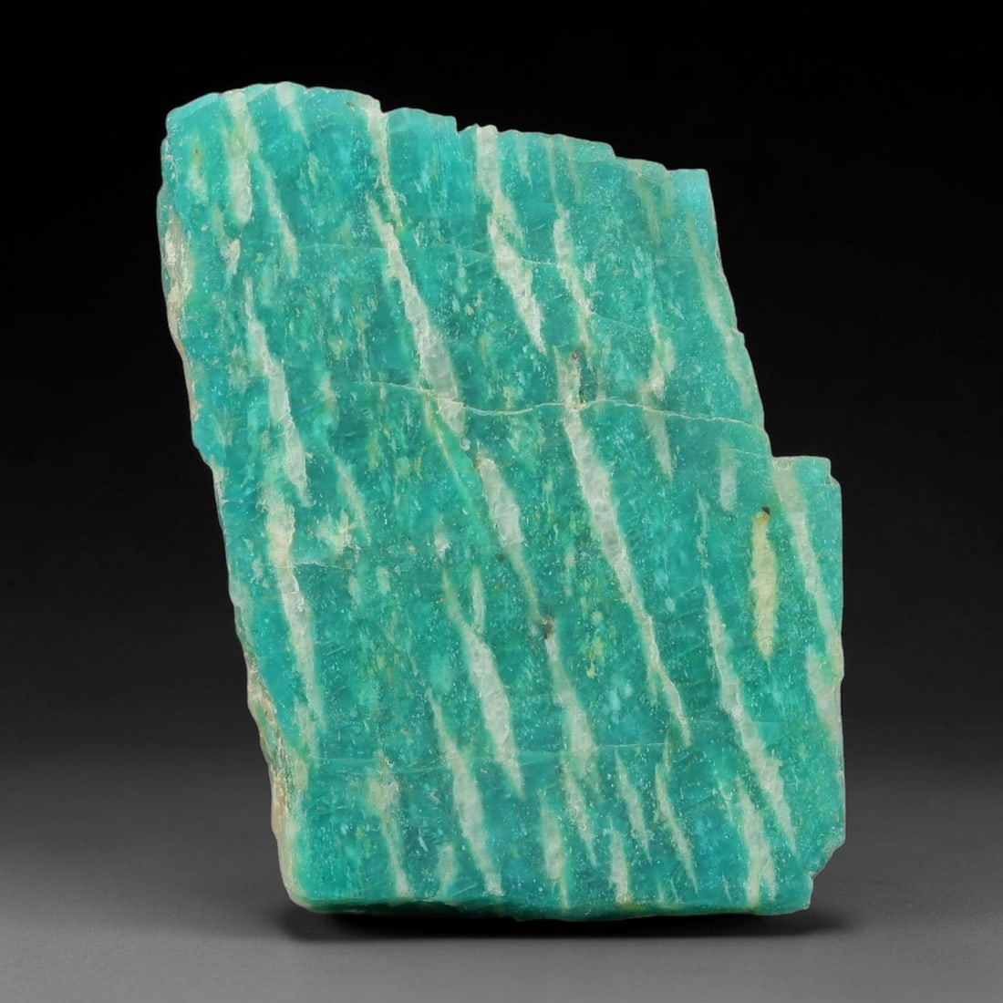 75ct Natural Russian Ural Amazonite Slab Rough, 74EB: This intact amazonite slab features distinct parallel mineral banding running uniformly across its naturally split flat surface within 38x29x8mm slab dimensions, retaining unmodified natural geologica