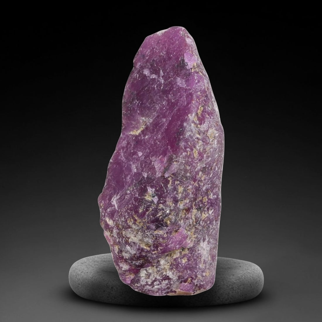 19.84ct Natural Mauritania Ruby Rough (Unheated), 50AT: Natural unheated corundum rough sourced from Mauritanian gem deposits, featuring a slender tapered crystalline form dominated by saturated uniform magenta-pink ruby corundum with sparse pale silicate 