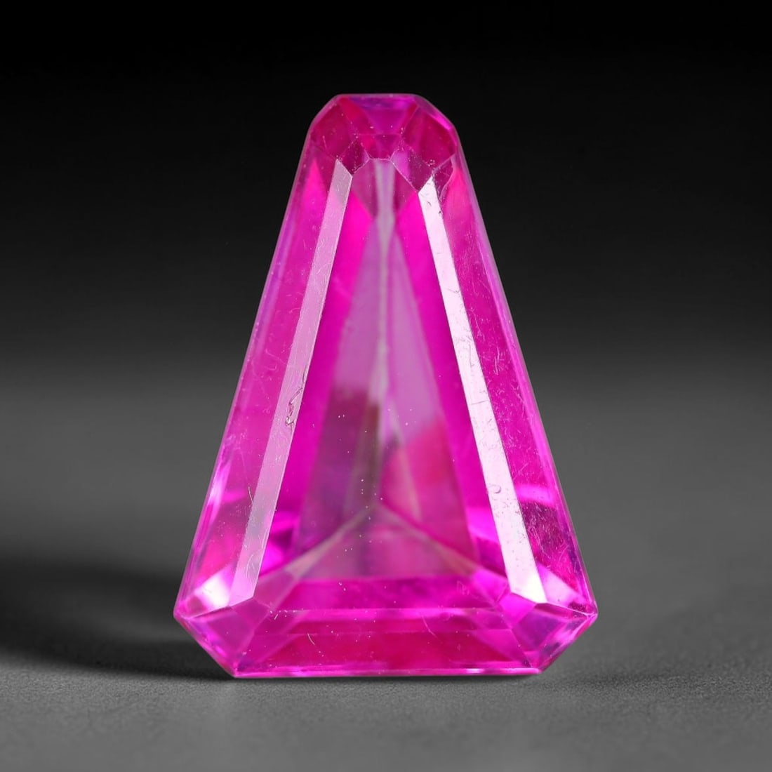9.77 Carats Natural Brazil Hot Pink Topaz Loose Gemstone, 9FE: This natural Brazil topaz holds dimension measurements of 17x12.4x6.8mm, displaying an intense vibrant hot pink shade created through surface color coating treatment, its transparent crystal body carr
