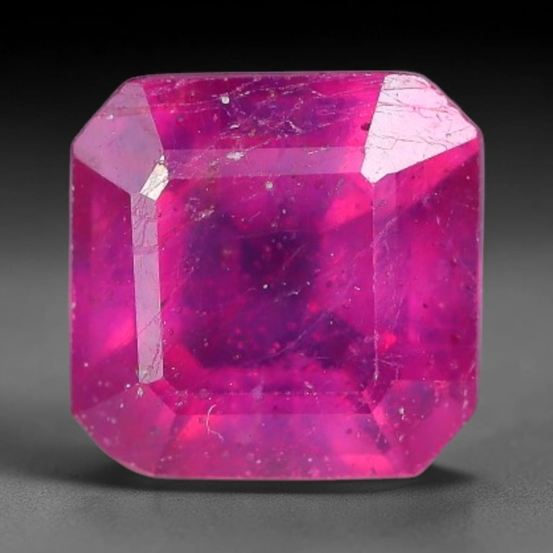 1.37 Carats Natural Madagascar Vivid Fuchsia Red Heated Ruby Loose Gemstone, 99AG: This vivid fuchsia red Madagascar ruby displays rich saturated red tone with subtle natural internal mineral traces that showcase genuine earth-grown character, measured at 6x3.7mm, the intense warm c